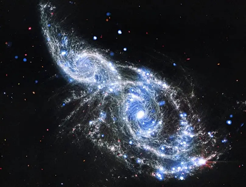 تصویر ترکیبی NGC 2207 و IC 2163